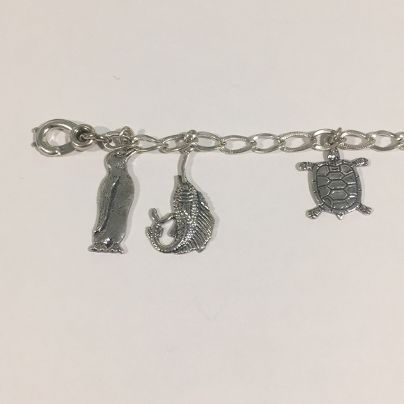 Sterling Silver Bracelet With 7 Different Charms - Picture 4 of 7